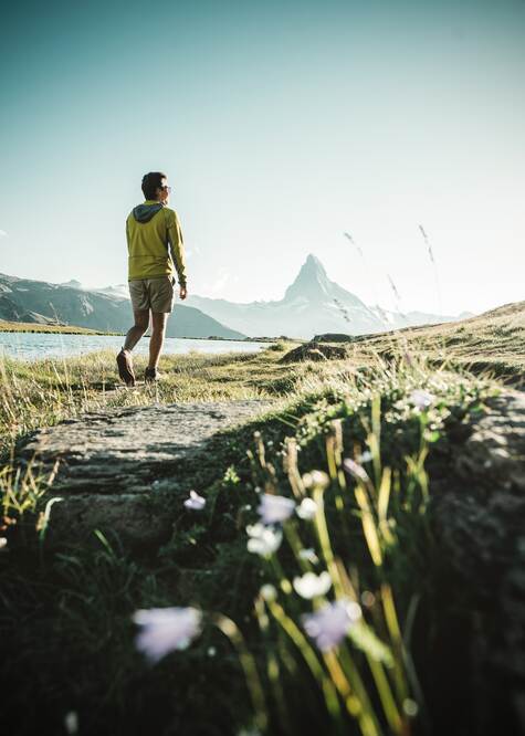Hiker at Stellisee in Zermatt